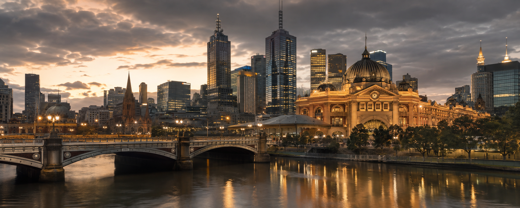 Melbourne skyline at sunset with Flinders Street Station and the Yarra River